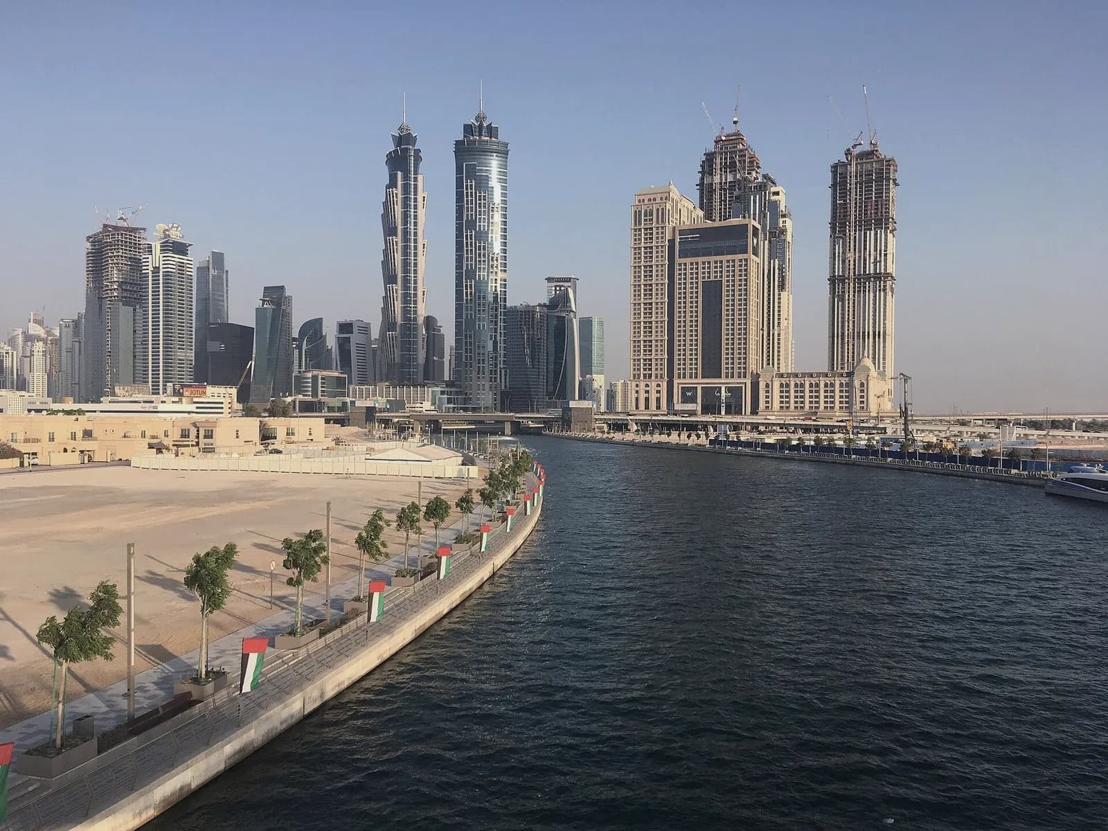 Towers rising along the Dubai Water Canal in Business Bay