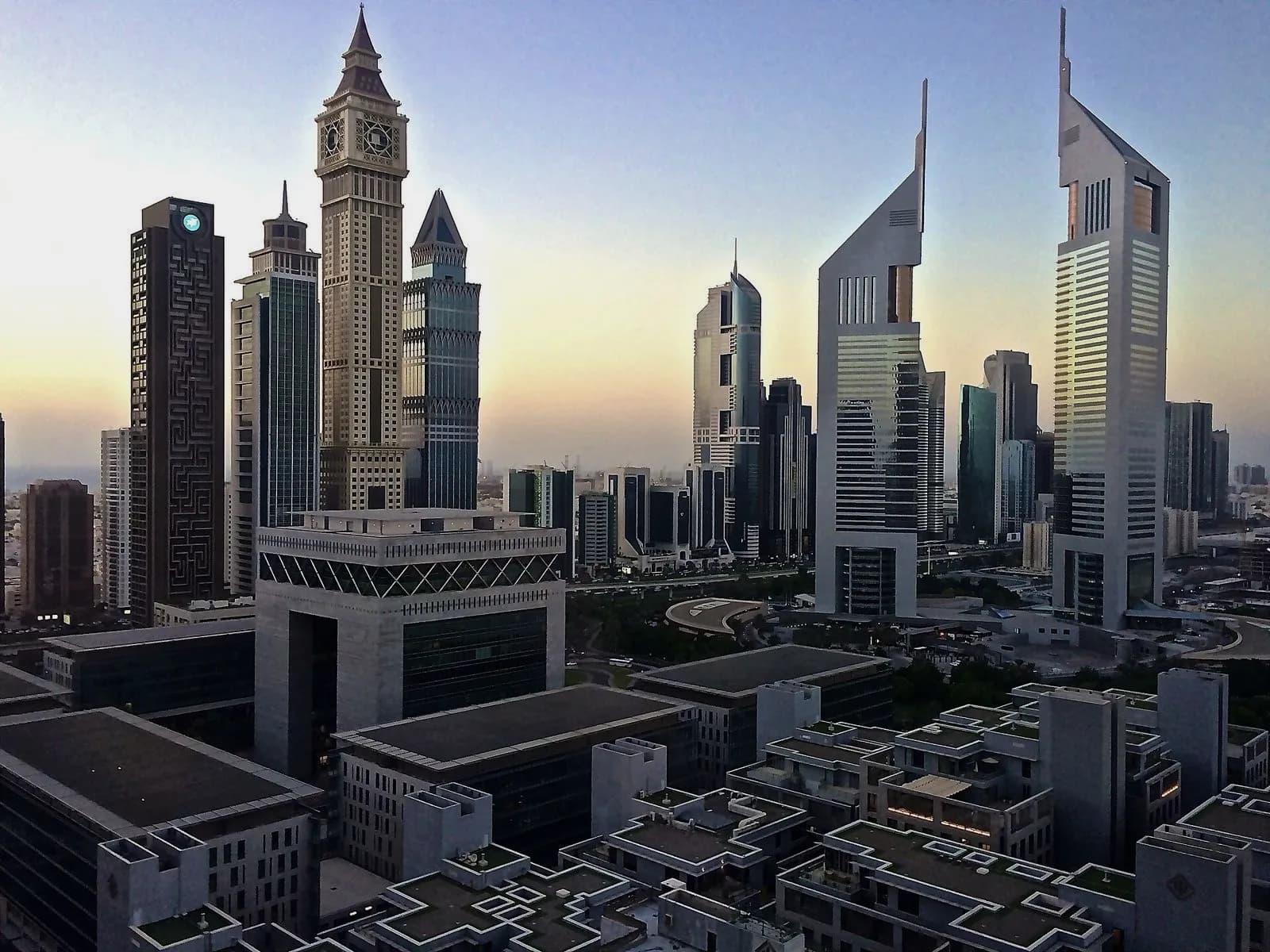 Emirates Towers and the DIFC Gate at dawn